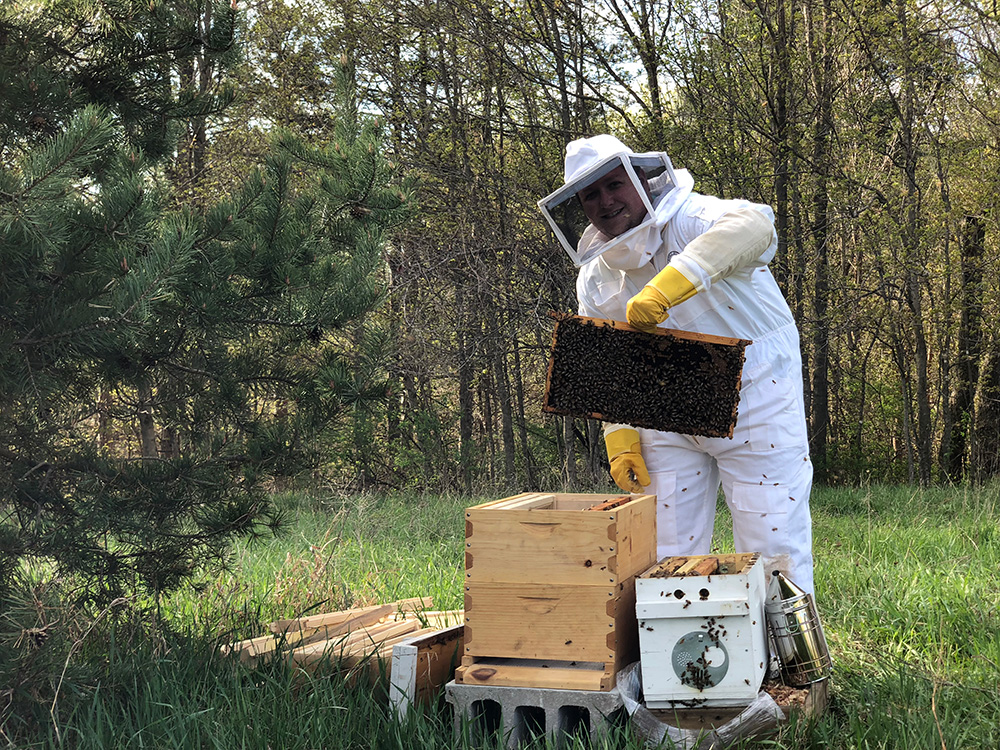 Eric Bassett tends to his bees.