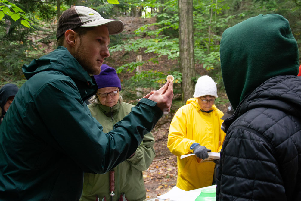 Lucas Dykstra leads a Mushroom ID 101 outing at Flower Creek Dunes Nature Preserve